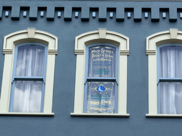Photos: Longtime Disney Exec Honored with Window on Magic Kingdom’s Main Street U.S.A.