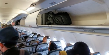 Flight passengers slam airlines for pushing early bag checks even with empty bins on board