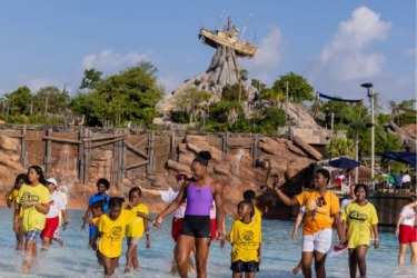 Walt Disney World Welcomes Nearly 600 Community Kids for the World’s Largest Swimming Lesson