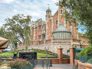 PHOTOS: Scrim Removed & Landscaping Added to Haunted Mansion in Magic Kingdom