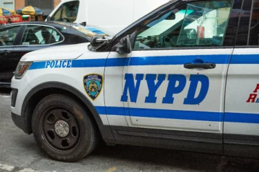 BMW driver smashes, flips NYPD cruiser — and injures 2 cops, video shows