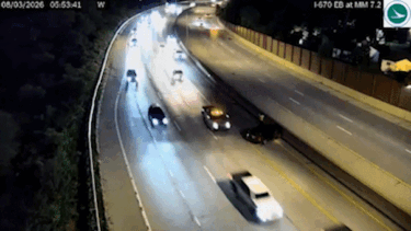 Vehicle narrowly avoids slamming into driver on side of Ohio highway, dramatic video shows