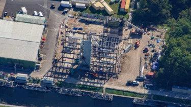 Construction site of a multi-story mystery building backstage at Magic Kingdom.