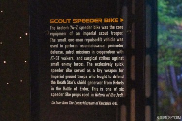 Scout Speeder Bike display exhibit at Lucas Museum of Narrative Arts, showcasing a detailed description of the Imperial scout trooper vehicle from Star Wars.