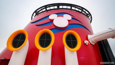 Colorful Disney Cruise Line themed structure with Mickey Mouse logo and wristbands.