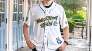 Person wearing Walt Disney World Veterans Day 2026 merchandise jersey.