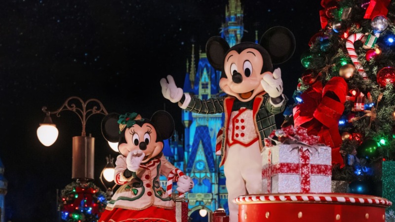 Mickey Mouse and Minnie Mouse with Christmas decorations in front of Cinderella Castle at Mickey's Very Merry Christmas Party