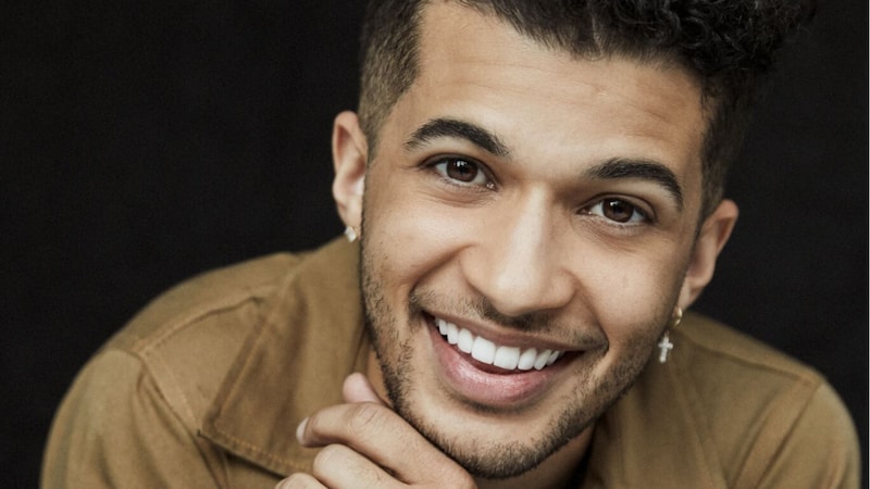 A headshot of Jordan Fisher