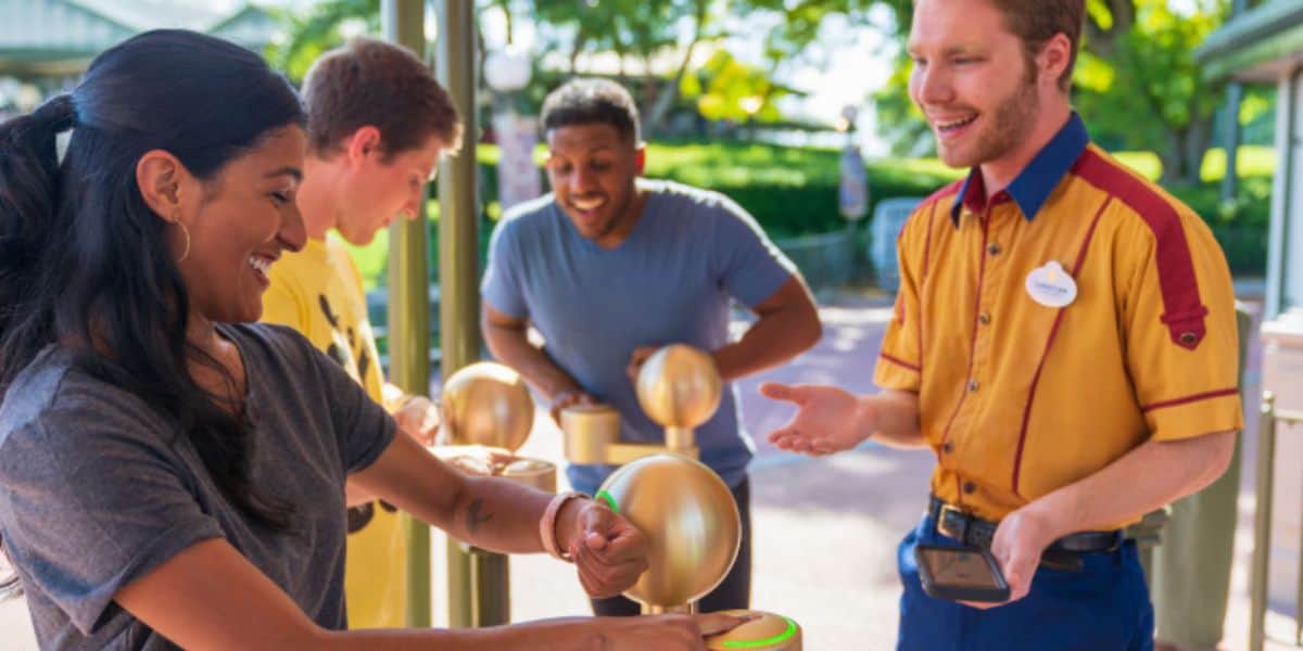 a guest scans her magic band at disney world